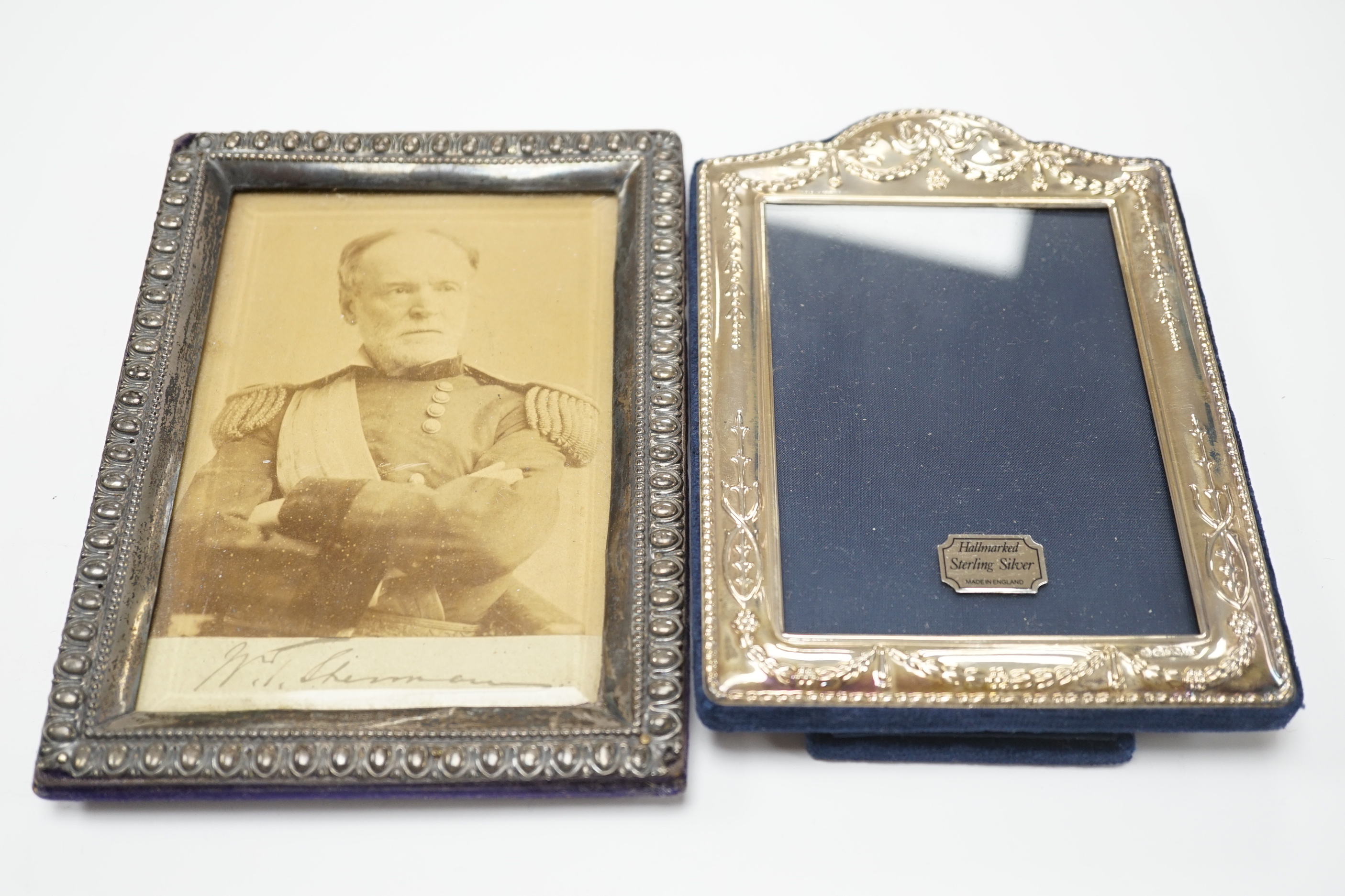 An Edwardian silver mounted photograph frame, Henry Matthews, Birmingham, 1904, 17.2cm and a modern silver mounted photograph frame.